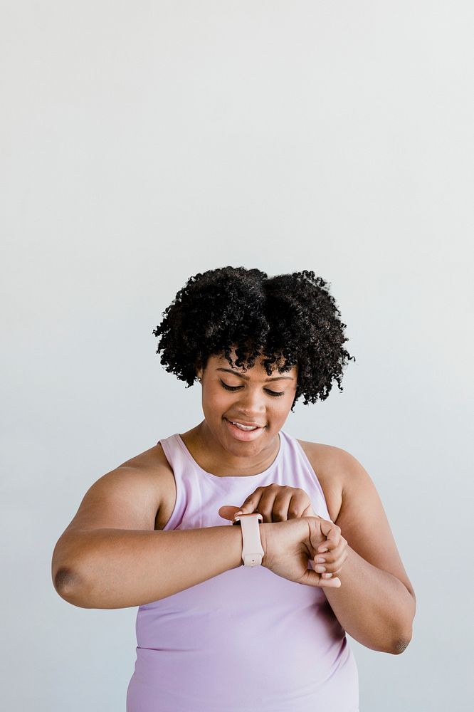Black young woman using a smartwatch