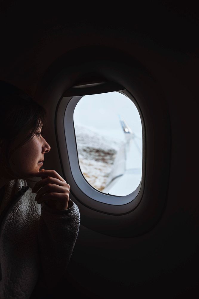 Traveler on a flight over the Atlantic ocean to the Faroe Islands