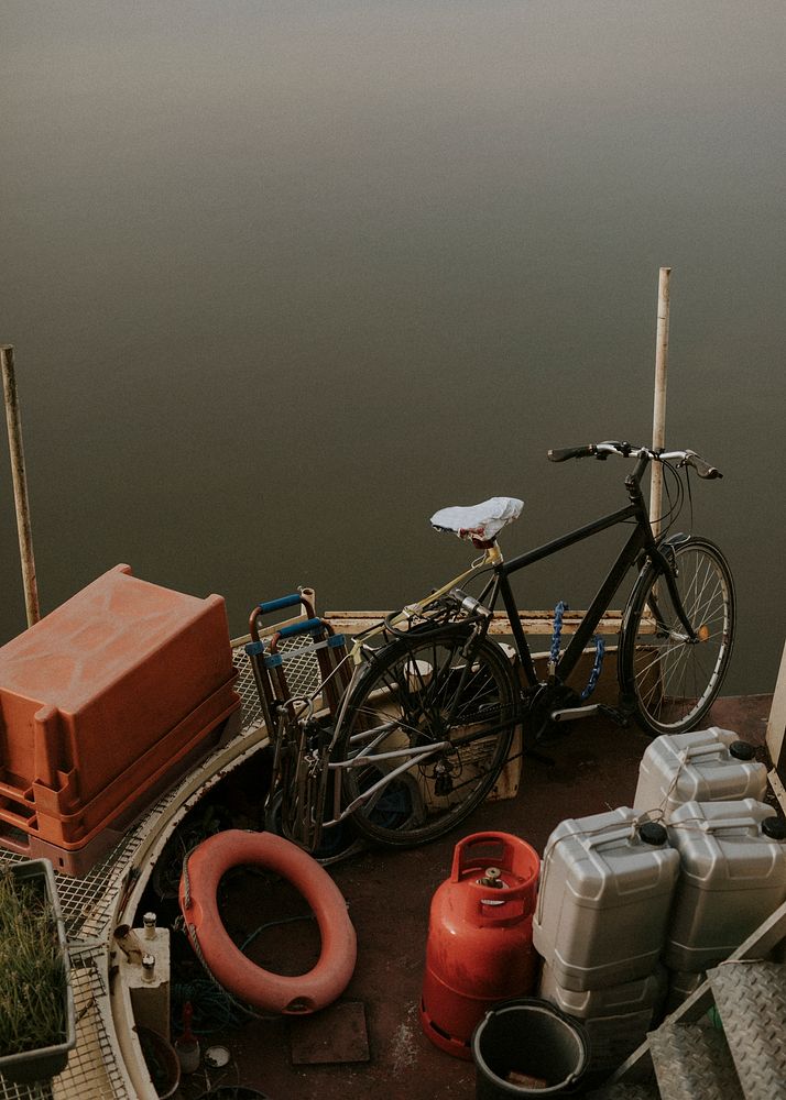 Old bicycle parked onboard a houseboat in Bristol harbour