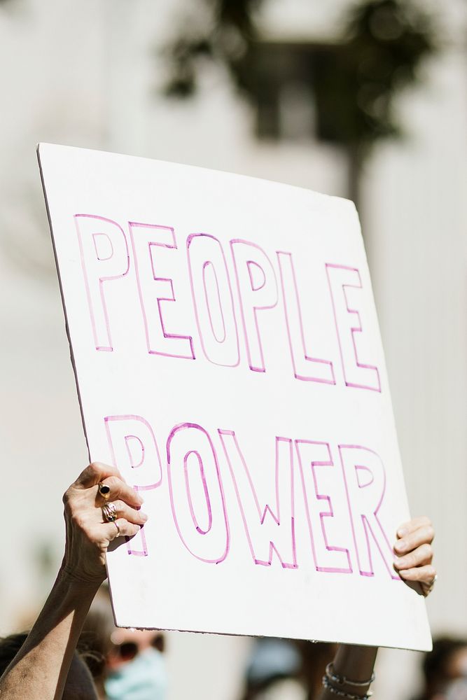 People power on a white placard at a black lives matter protest 