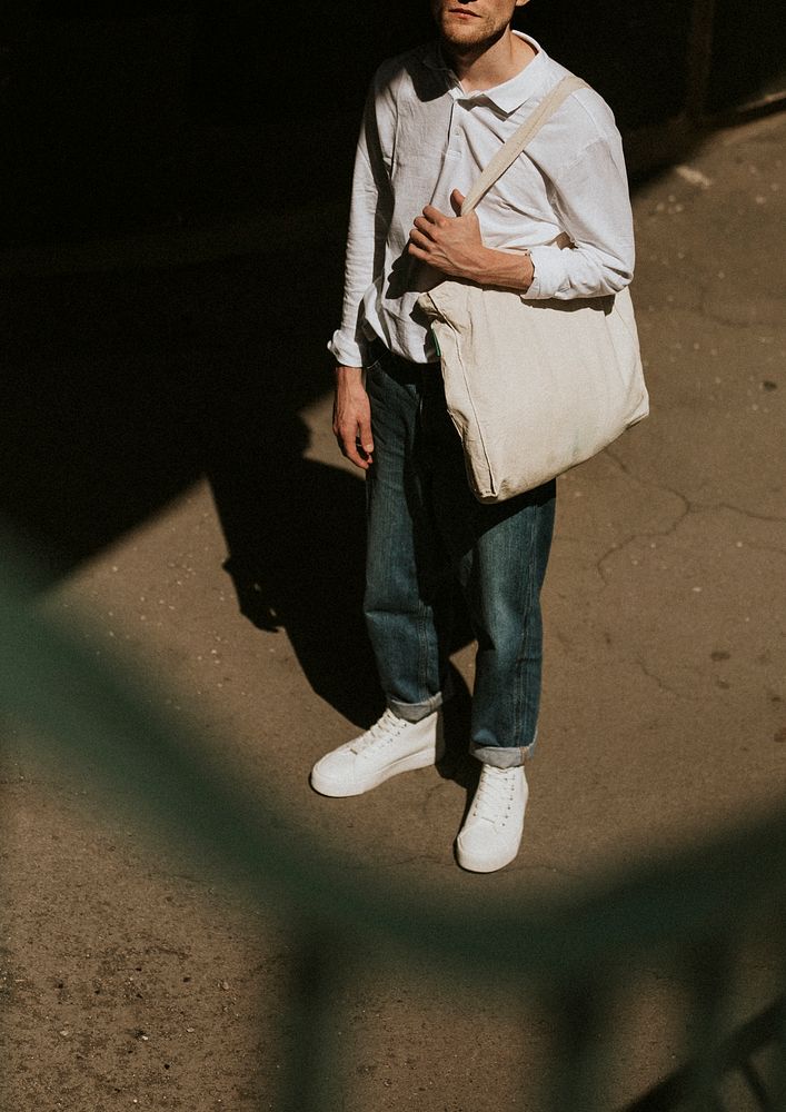 Casual man with eco bag dark tone