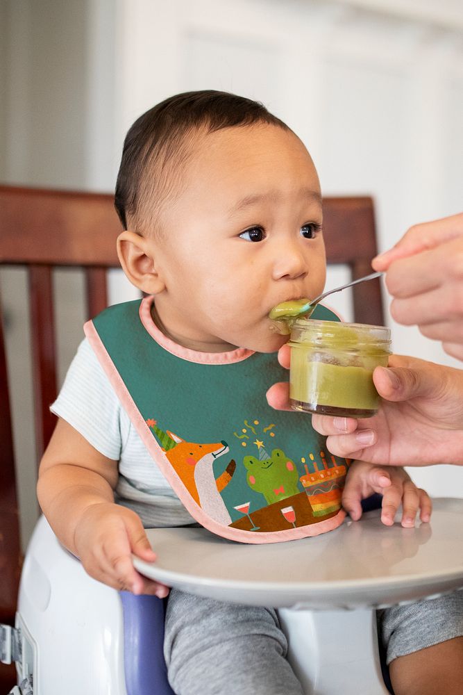 Baby eating homemade vegeatble puree