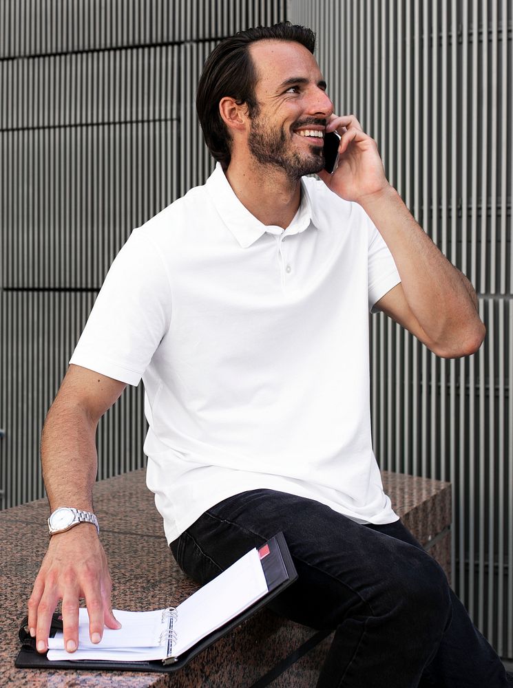 White polo shirt man talking on the phone menswear apparel fashion