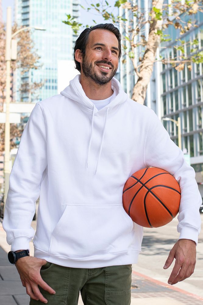 Hoodie on a man with basketball in the city
