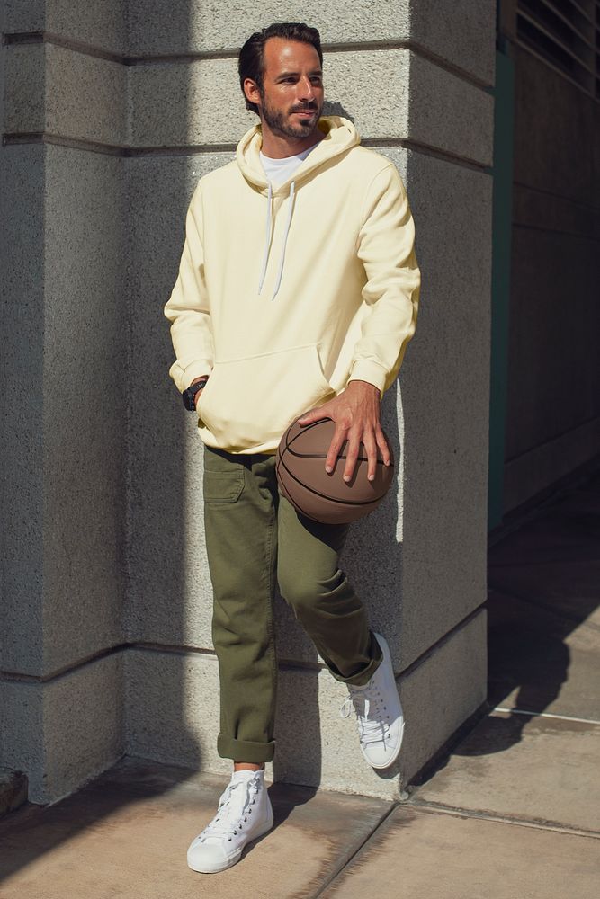 Yellow hoodie mockup psd man with basketball