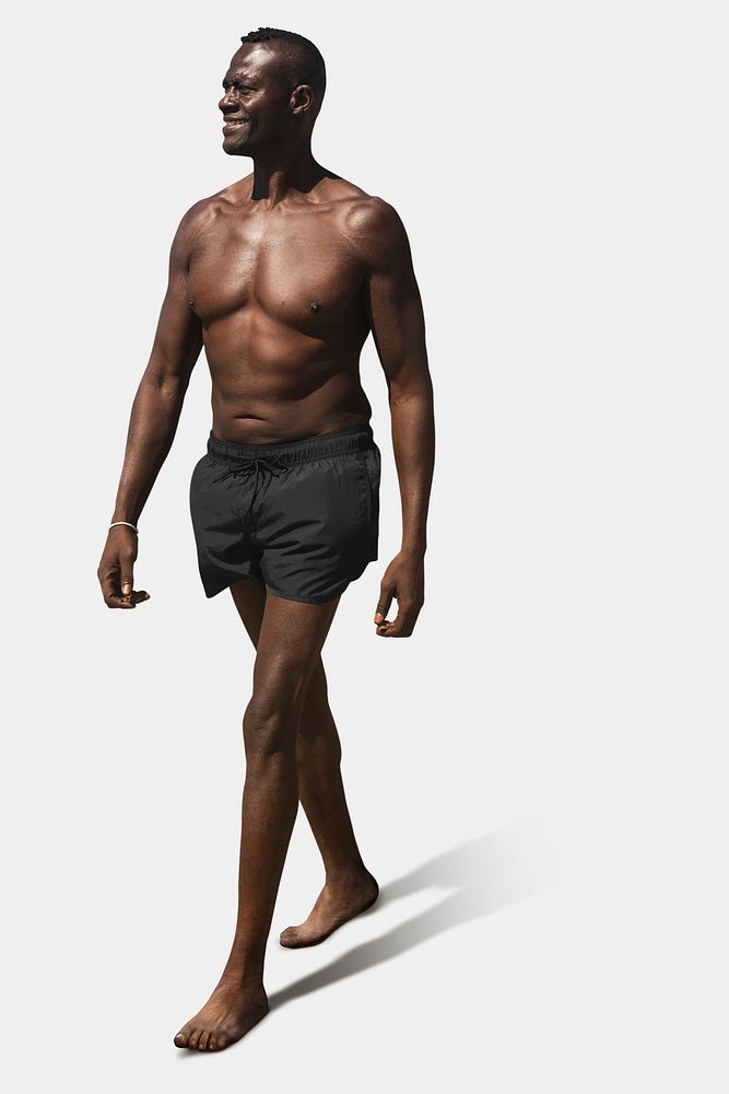 African American man in shorts shirtless summer full body studio shoot