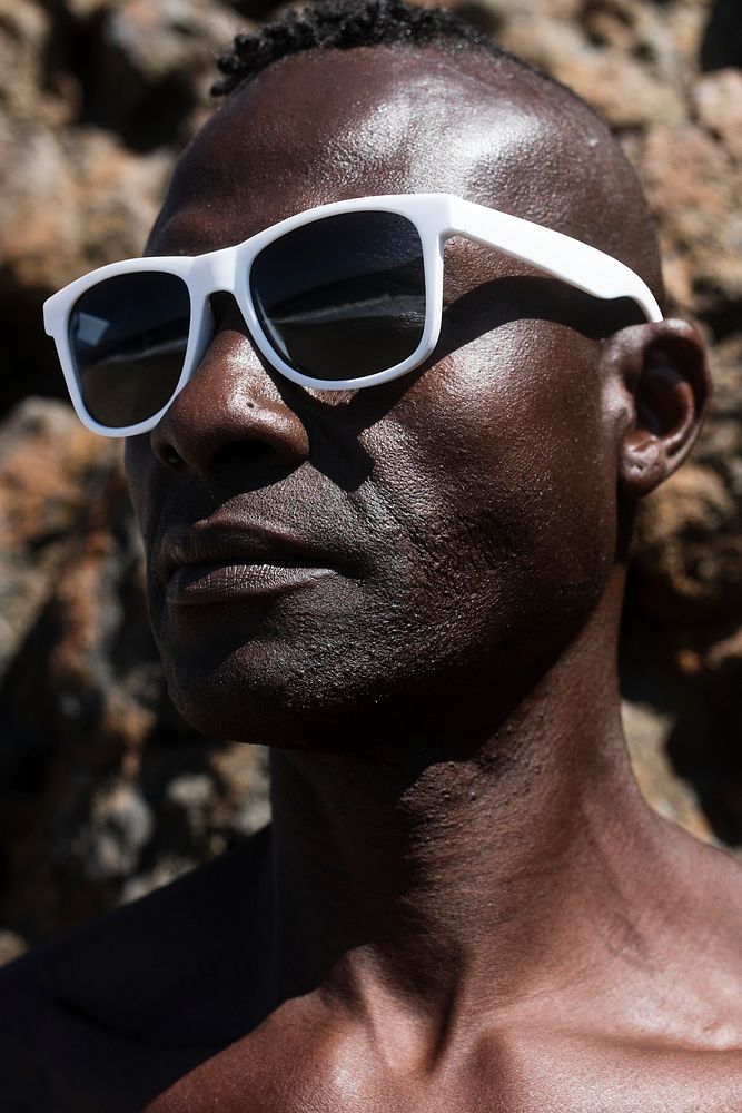 African American man wearing stylish sunglasses summer fashion close up
