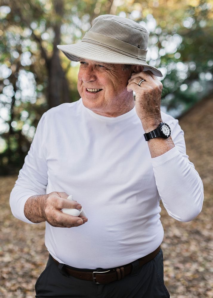 Grandpa&rsquo;s apparel mockup psd using his wireless earbuds