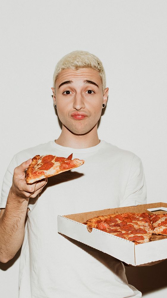 A man having a pepperoni pizza mobile wallpaper