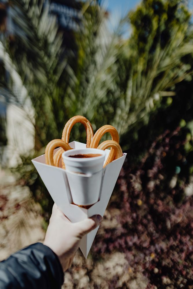 Woman holding a churros snack