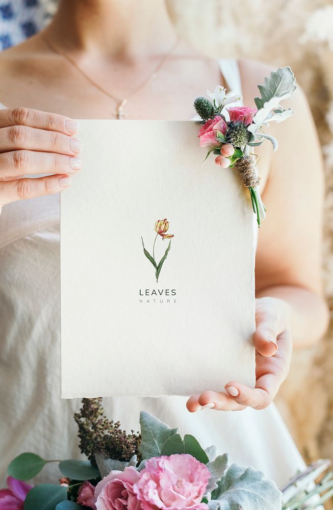 Bride holding a floral card