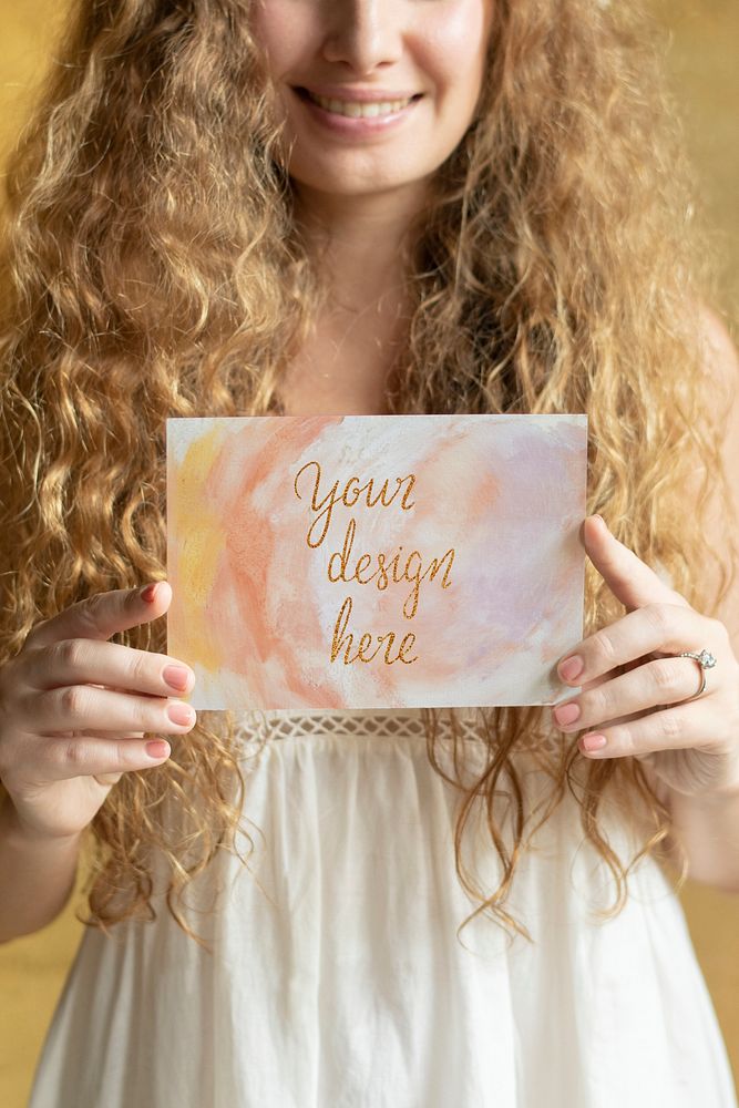Blond woman with an invitation card mockup