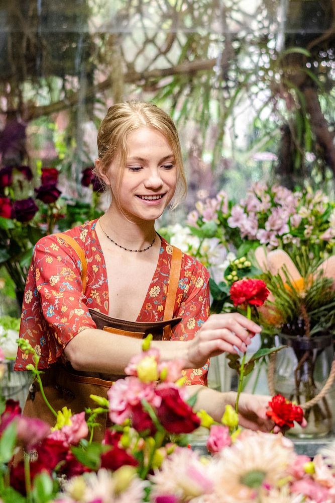Florist arranging flowers in her shop