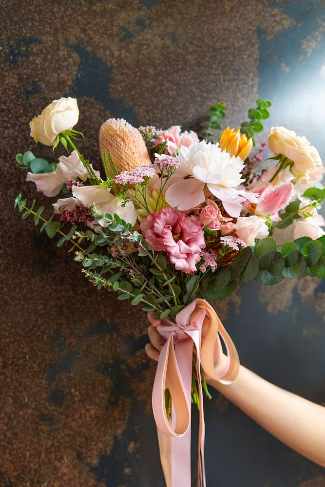 Woman holding a bouquet of flowers