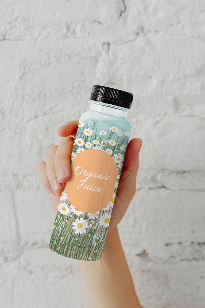 Juice bottle mockup, floral design psd