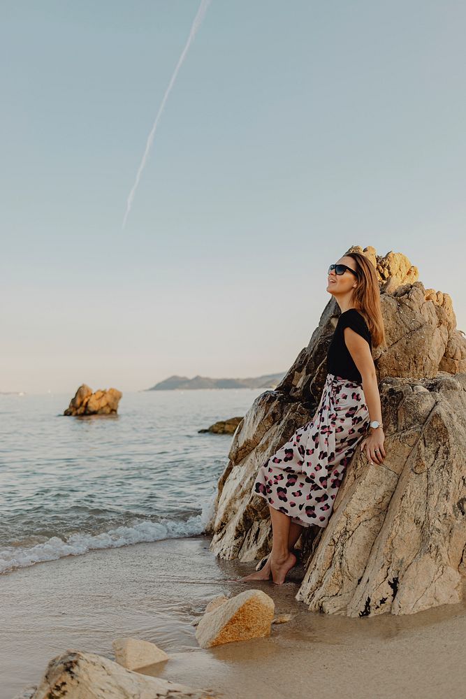 Woman at a rocky beach