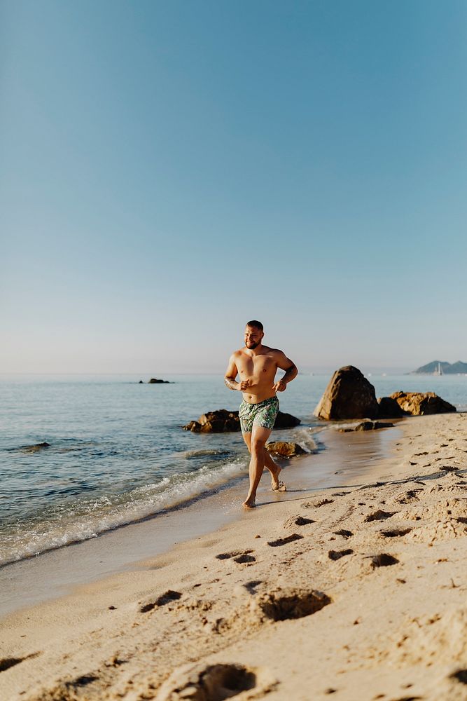 Man jogging along the beach