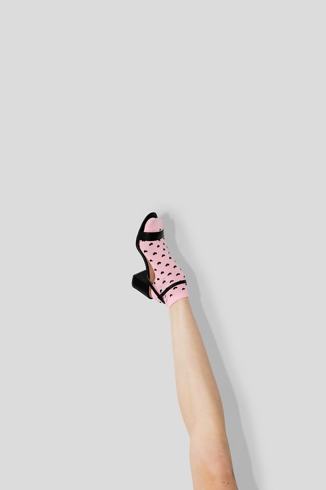 Woman in heels with a pink sock 