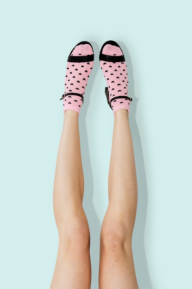 Woman in heels wearing pink socks