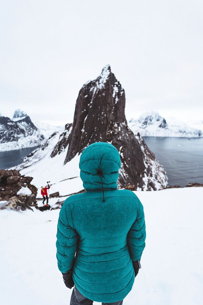 Woman hiking up Segla mountain, Norway