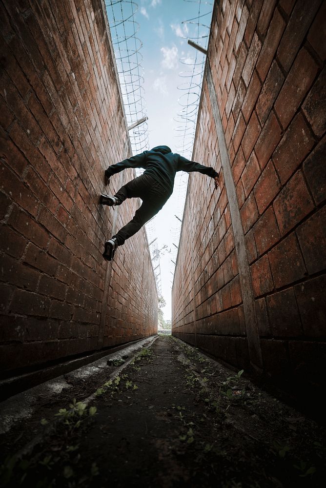 Man jumping between walls, Parkour sport