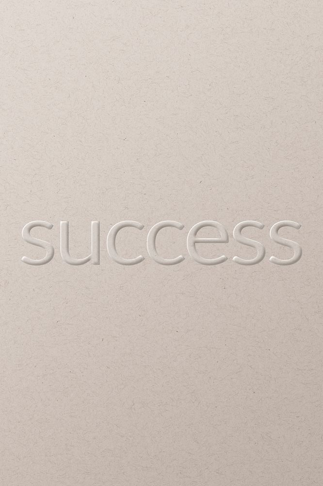 Success embossed text white paper background
