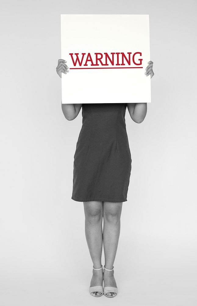 Woman hold caution alert sign