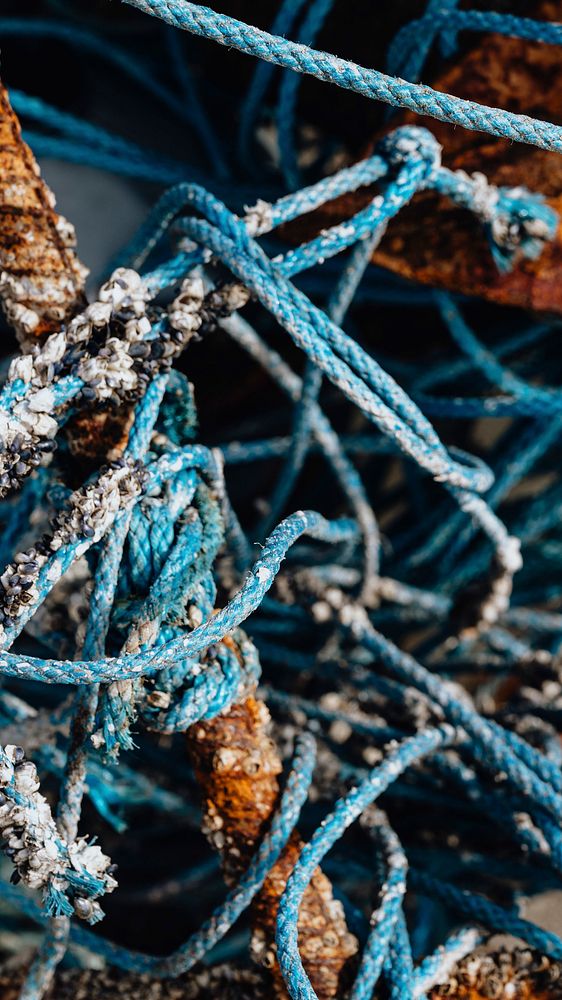Blue ropes and rusty fishing equipment textured mobile wallpaper