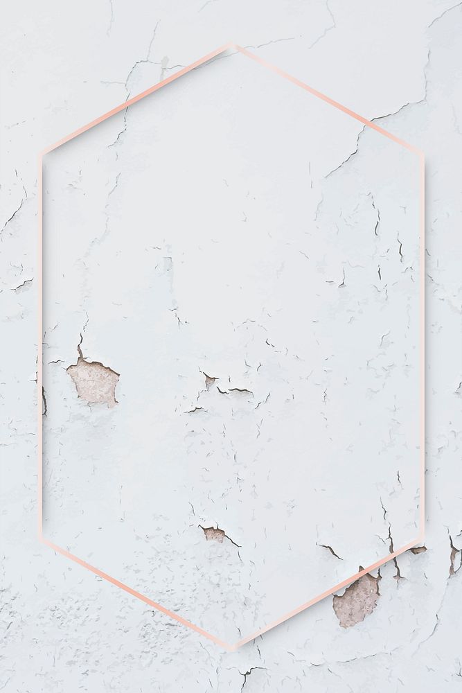 Hexagon rose gold frame on weathered paint wall background vector