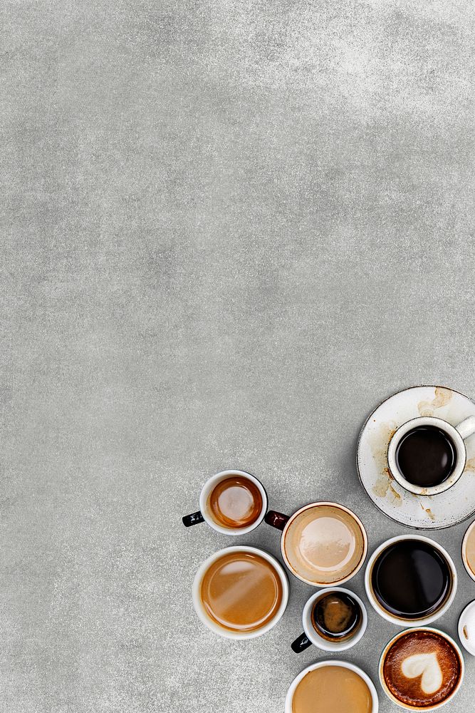 Various coffee cups on a gray textured wallpaper