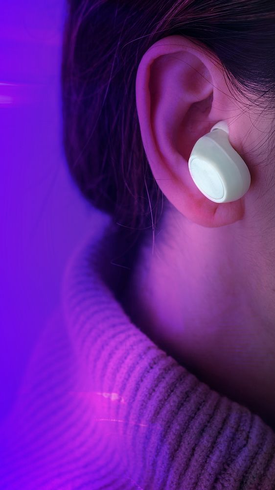 Purple technology background with woman in wireless earphone