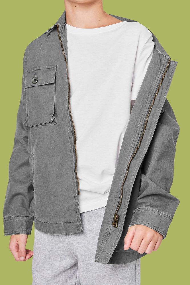 Boy wearing gray jacket in studio