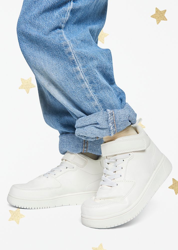 Child wearing jeans white sneakers studio shot