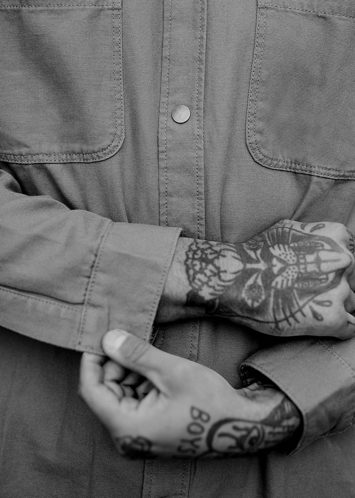 Tattooed man hands, men's fashion, gray photo