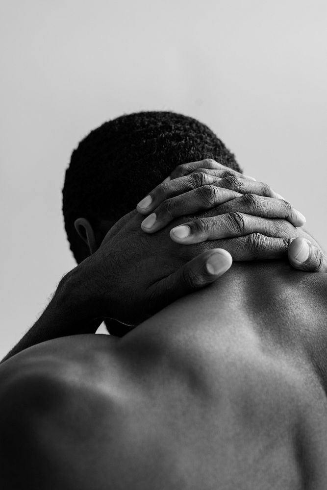 Muscular African American man, gray photo