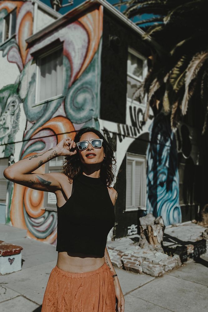 Tattooed woman wearing sunglasses portrait, Venice Beach, LA