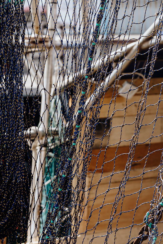 Fishing nets drying in the summer sun at the harbor