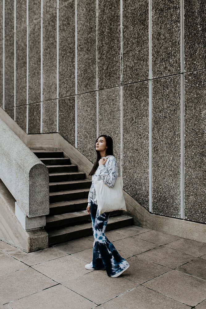 Woman carrying tote bag, fashion photo