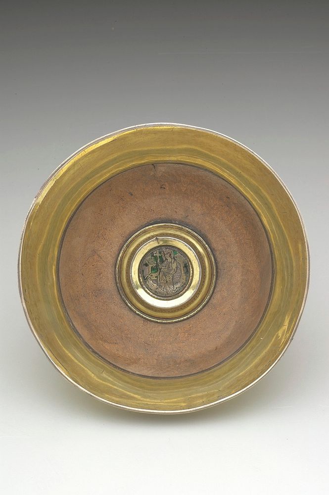 wide maple bowl with wide splayed silver gilt lip; in center is a raised boss enclosing an engraved silver medallion of St.…