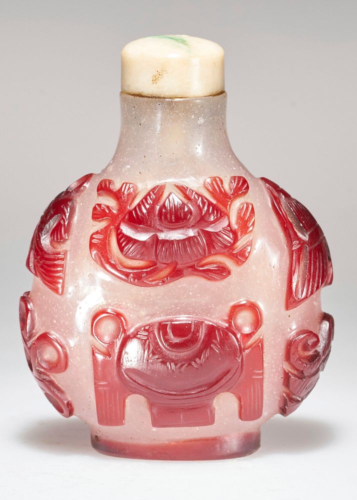 white jade top; design carved in red glass on white. Original from the Minneapolis Institute of Art.