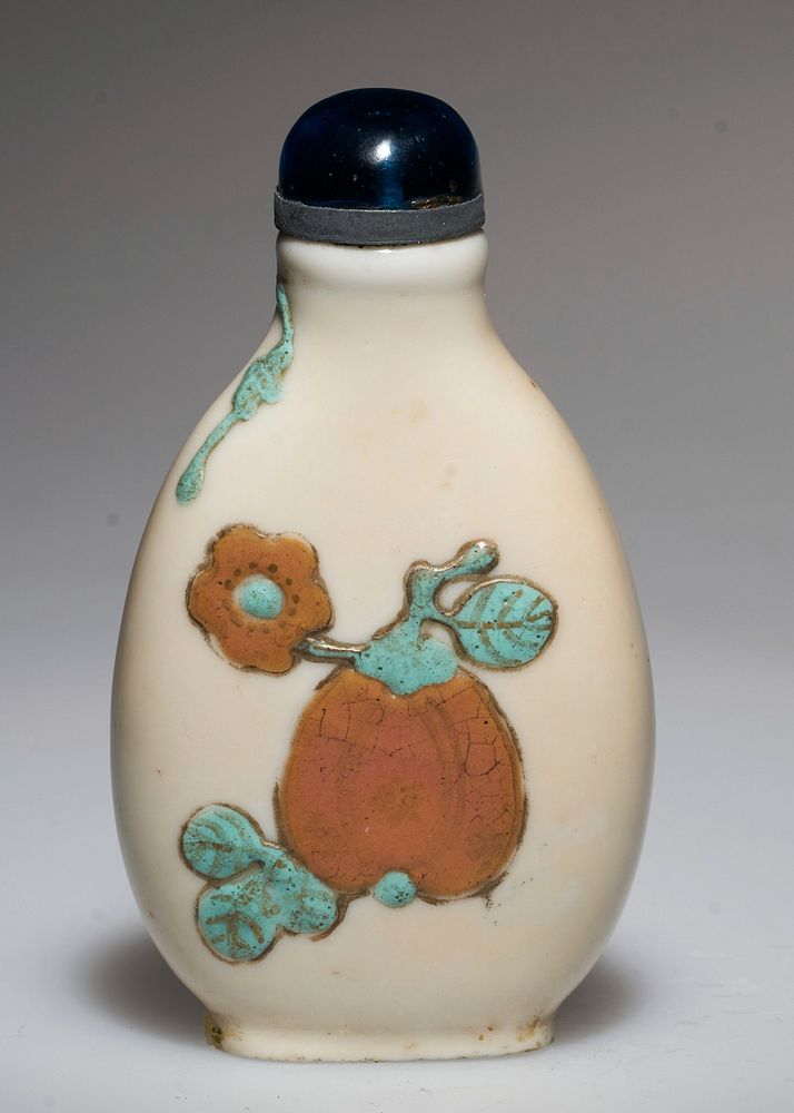 Snuff Bottle. White Glaze Porcelain. Glass top. Raised design in turquoise, blue and yellow.. Original from the Minneapolis…