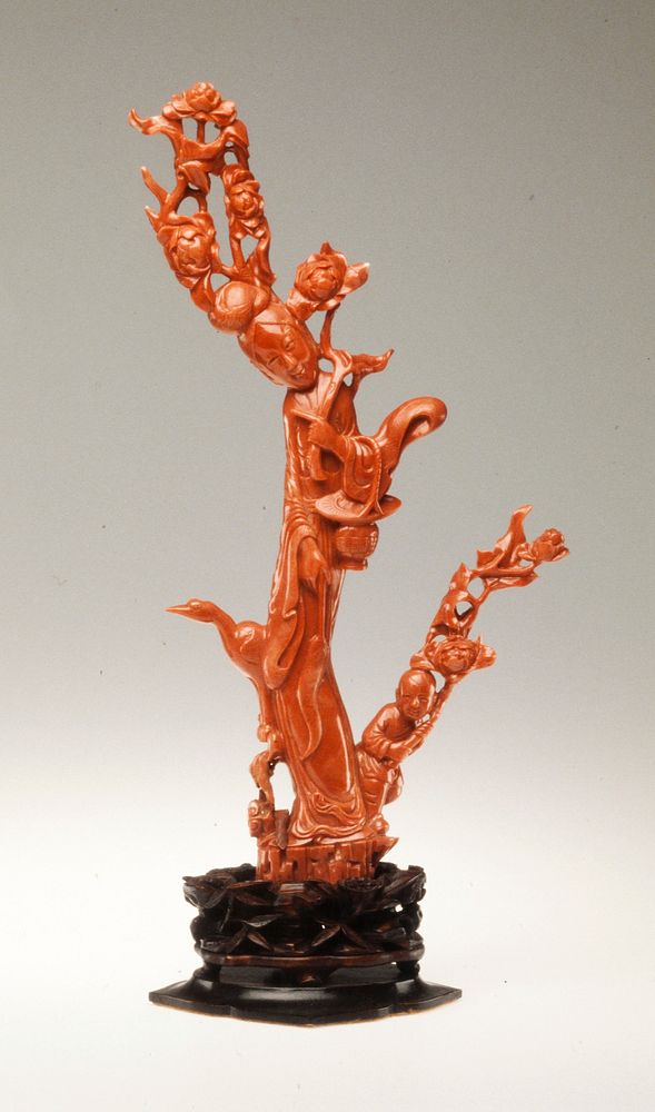 Statue of the Taoist divinity Hsi Wang Mu, red coral; carved wood base.. Original from the Minneapolis Institute of Art.