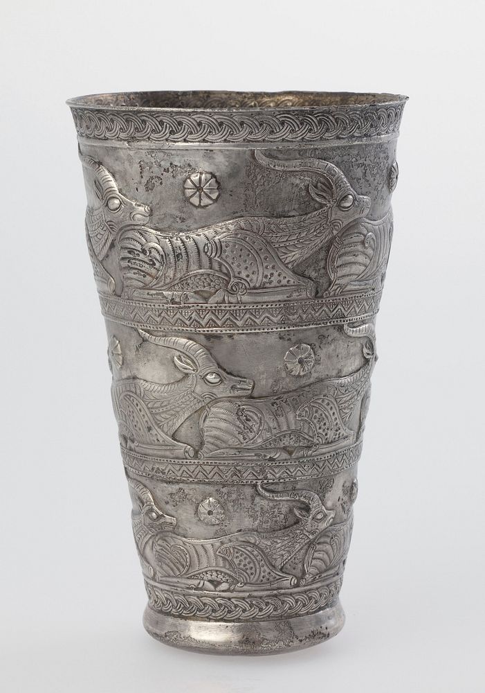 Repoussé silver beaker with decoration of reclining ibexes arranged in three rows. Original from the Minneapolis Institute…