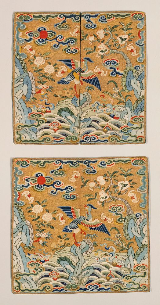 Pair of gold k'ossu mandarin squares. The central motif is a crane? Standing on a rock that emerges from the Eternal Sea. In…