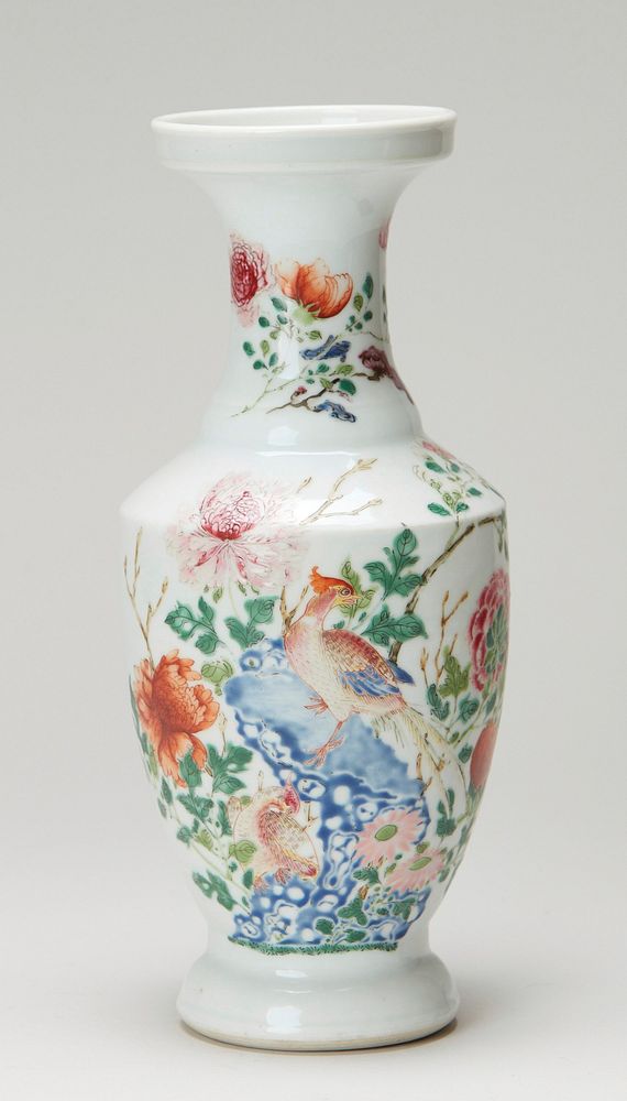 vase, famille rose, decorated with a motif of peony plants and flowers grouped around a crag of rocks; semi-beaker shape.…