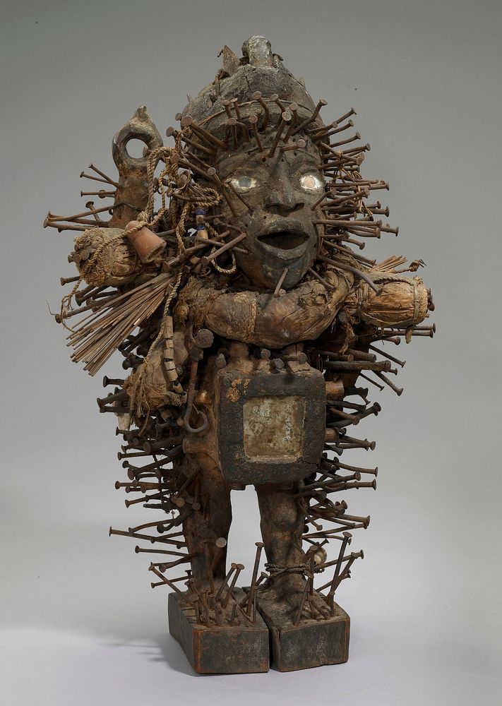 Nkisi Nkonde (nail fetish); a fetish figure in wood; the surface is covered with a variety of accoutrements: nails, reed…