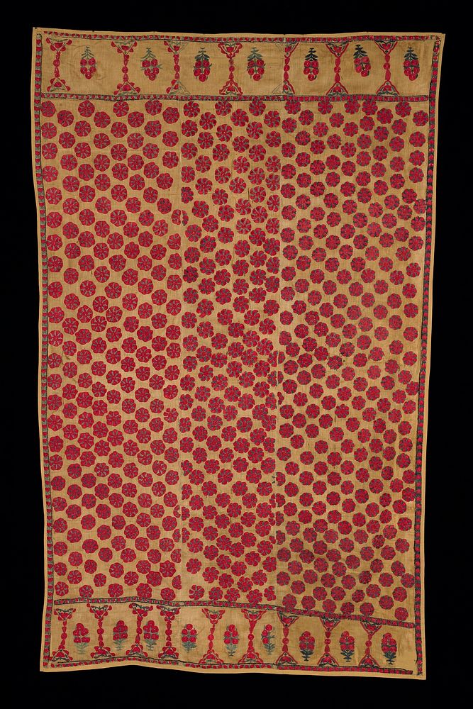 mustard yellow cotton fabric, attached to support fabric of the same color; overall embroidery of red and green floral…