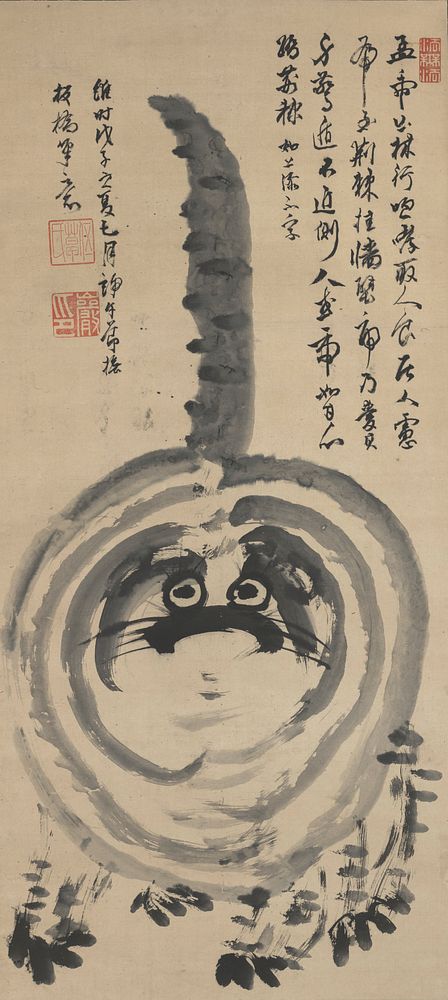 Front view of cartoonish striped cat with tail sticking straight up in the air behind; large eyes with eyelashes; whiskers…