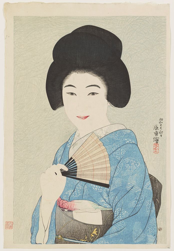 Bust portrait of young woman wearing a blue kimono and black obi with yellow flowers, holding a striped fan. Original from…