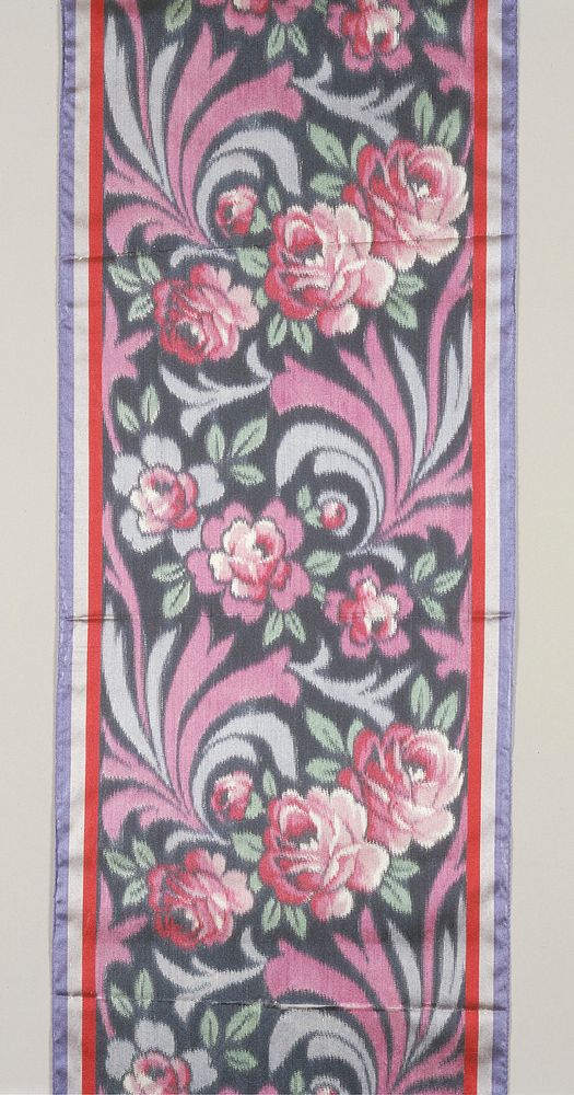 red rose pattern with red and blue leaf pattern dividing roses; dark field; red, white and blue banding on edges. Original…